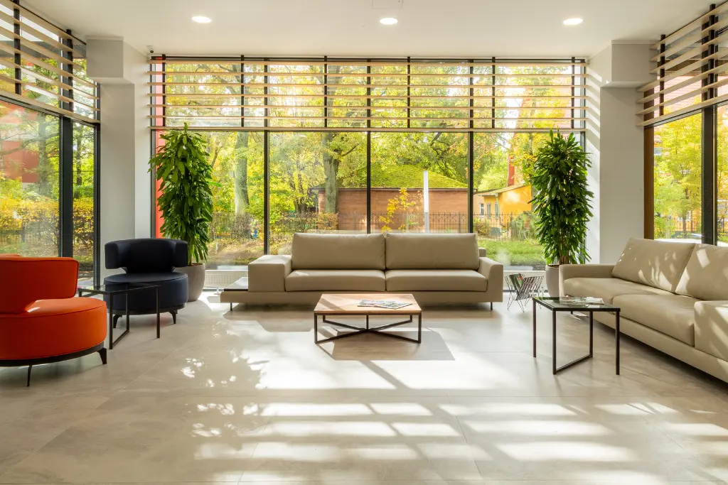 Modern living room design with comfortable seating, natural light, and a clean, spacious layout