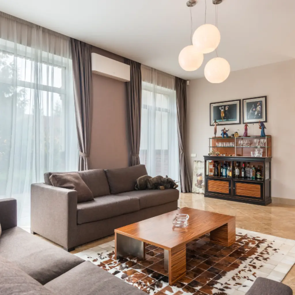 Modern living room interior design with sofa, wooden table, and warm lighting